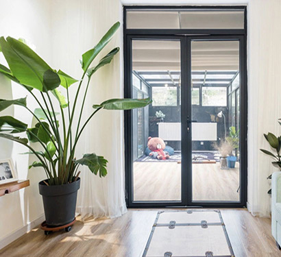 Double black aluminum hinged door with transom window